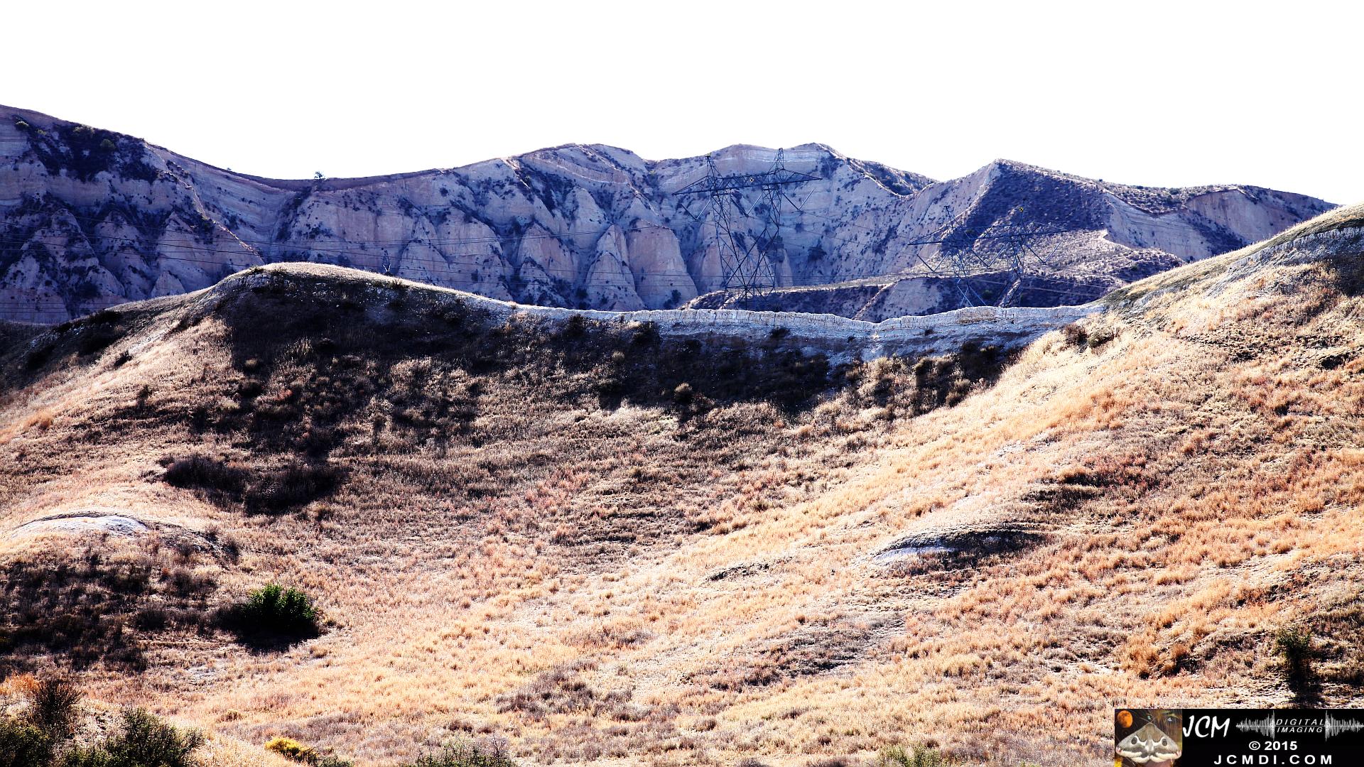 Landslide, buckled pavement, and terrain at Vasquez Canyon Road in Santa Clarita, CA filmed 11-25-2015